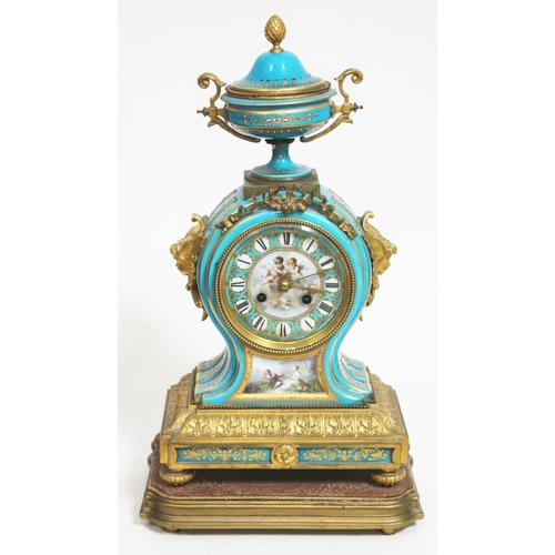 19 - A French 19th century ormolu and Sevres style blue porcelain clock having urn top, twin cherub mask ... 