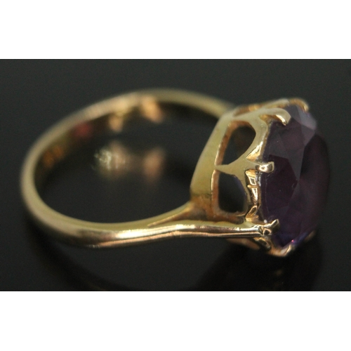 200 - An amethyst ring, the stone diam. 12mm and depth 6mm, band unmarked, gross wt. 5g, size N.