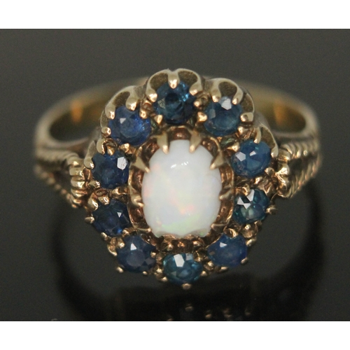 203 - A precious opal and sapphire ring, the setting measuring approx. 13mm x 12mm, hallmarked 9ct gold ba... 