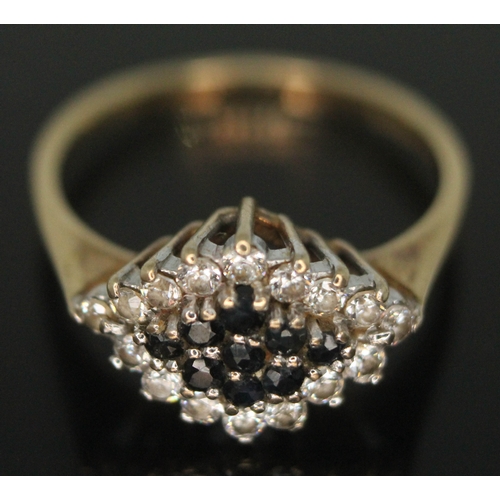 204 - A diamond and sapphire cluster ring, hallmarked 9ct gold band, gross wt. 2.32g, size N.