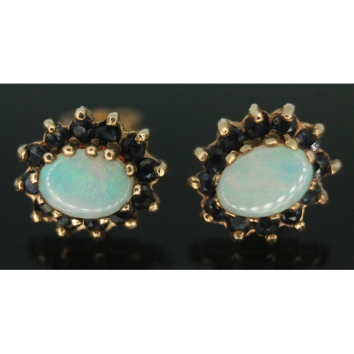 208 - A pair of hallmarked 9ct gold precious opal earrings, setting measuring approx. 11mm x 9mm, gross wt... 