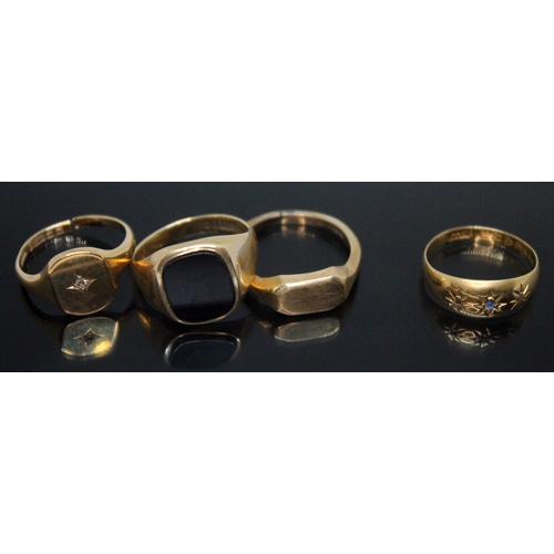 218 - A group of four rings comprising three hallmarked 9ct gold, wt. 11.74g, and a hallmarked 18ct gold r... 