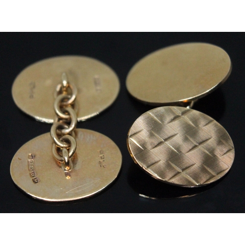 219 - A pair of hallmarked 9ct gold cufflinks, wt. 8.87g.