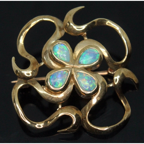 226 - A modern Arts & Crafts style hallmarked 9ct gold brooch set with four pear shaped precious opal cabo... 