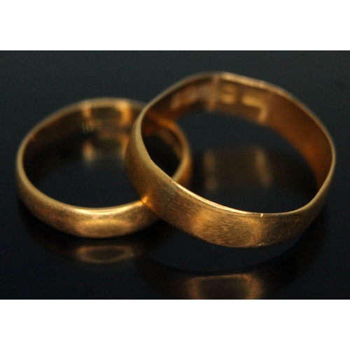 228 - Two hallmarked 22ct gold wedding bands, gross wt. 6.13g.