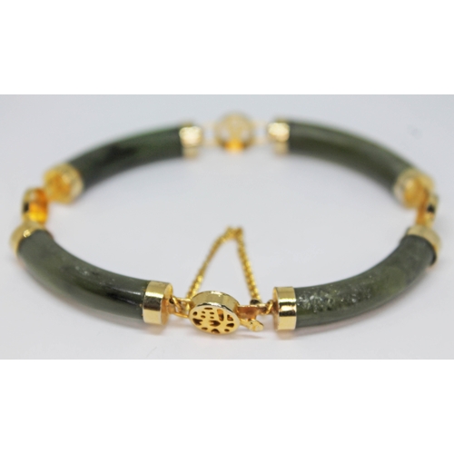 230 - A Chinese yellow metal and nephrite jade bracelet, unmarked, diam. approx. 6.5cm.