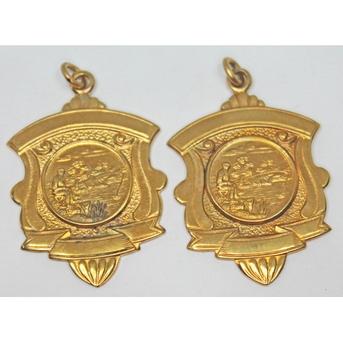 254 - Two hallmarked 9ct gold medals, wt. 15.73g.