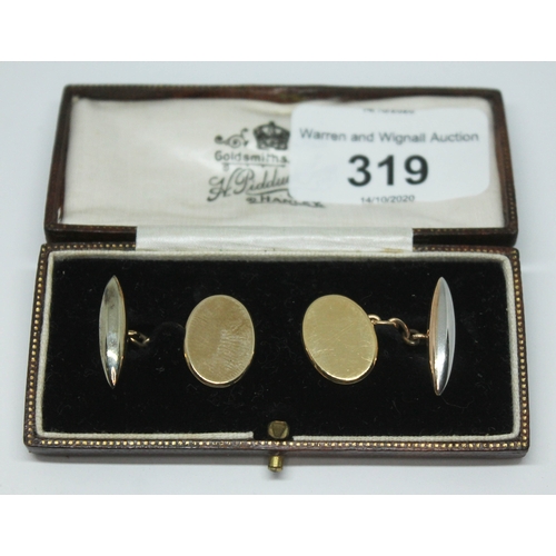 319 - A cased pair of cufflinks, one marked '18ct 9ct&PT', no engravings, wt. 7.12g.