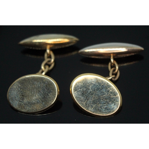 319 - A cased pair of cufflinks, one marked '18ct 9ct&PT', no engravings, wt. 7.12g.