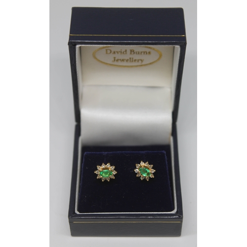 377 - A pair of diamond and emerald cluster ear studs, the cluster measuring approx. 9mm x 7mm, Portuguese... 