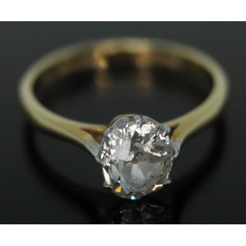 379 - A diamond solitaire ring, the old oval/cushion cut stone weighing approx. 1.00 carats in eight claw ... 