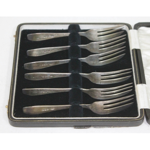 98 - A cased set of hallmarked silver cake forks.