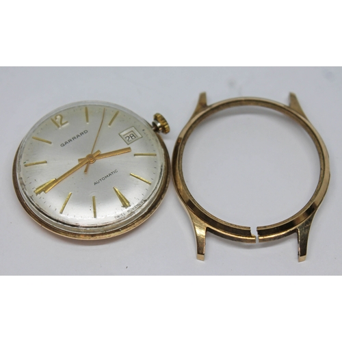 147 - A gents 9ct gold Garrard automatic wristwatch with champagne dial and hour markers and hands in gold... 