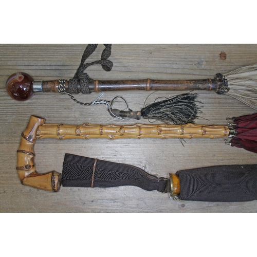 449 - A group of three vintage parasols including one with an agate spherical top.