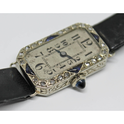 109 - A French Art Deco diamond and sapphire set cocktail watch, case length 23mm, marked with an eagle's ... 