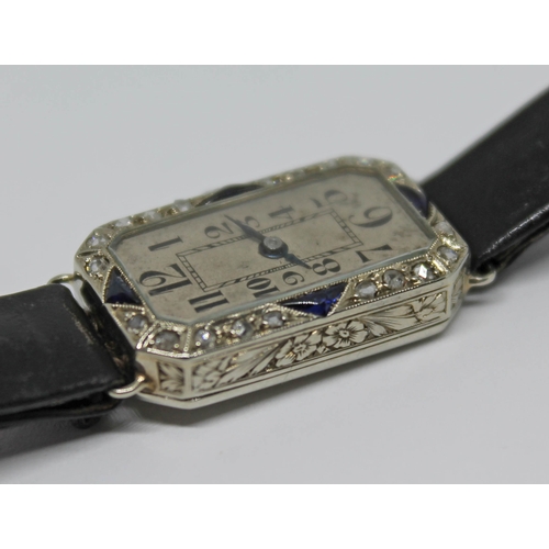 109 - A French Art Deco diamond and sapphire set cocktail watch, case length 23mm, marked with an eagle's ... 