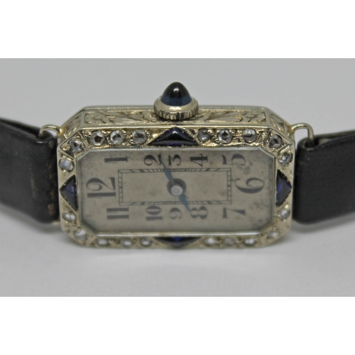 109 - A French Art Deco diamond and sapphire set cocktail watch, case length 23mm, marked with an eagle's ... 