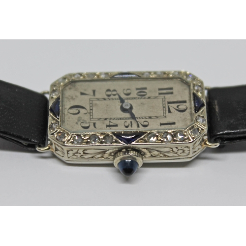 109 - A French Art Deco diamond and sapphire set cocktail watch, case length 23mm, marked with an eagle's ... 