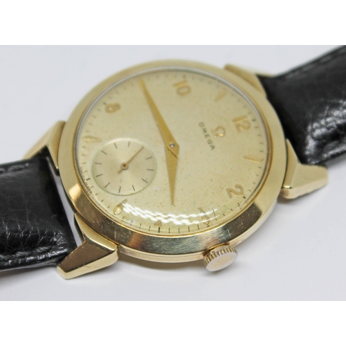 118 - A 1952 gold plated Omega wristwatch with gold tone signed dial, alternate Roman numerals and hour ba... 