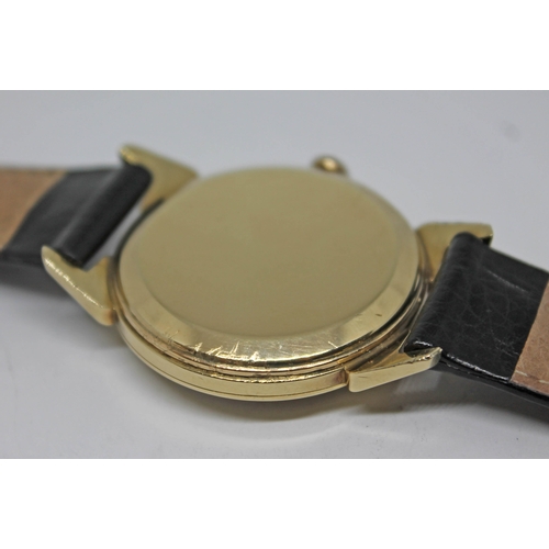 118 - A 1952 gold plated Omega wristwatch with gold tone signed dial, alternate Roman numerals and hour ba... 