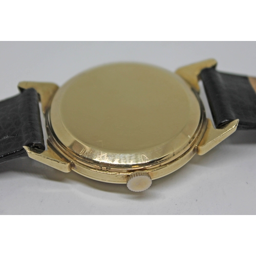 118 - A 1952 gold plated Omega wristwatch with gold tone signed dial, alternate Roman numerals and hour ba... 