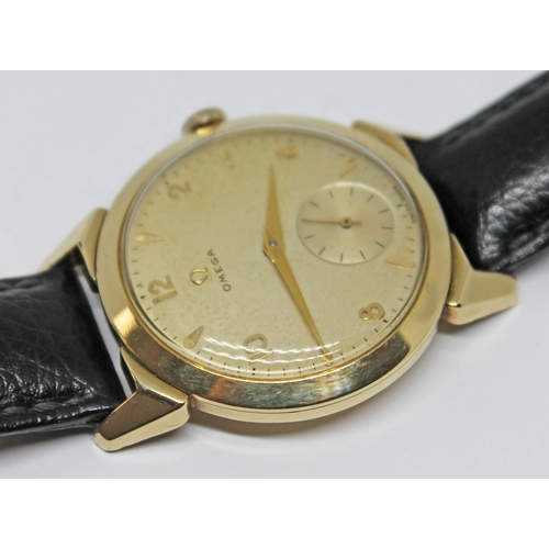 118 - A 1952 gold plated Omega wristwatch with gold tone signed dial, alternate Roman numerals and hour ba... 