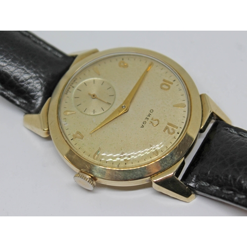 118 - A 1952 gold plated Omega wristwatch with gold tone signed dial, alternate Roman numerals and hour ba... 