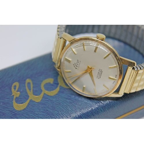 122 - A 1960s hallmarked 9ct gold Elco wristwatch with signed champagne dial, gold tone hour markers and d... 