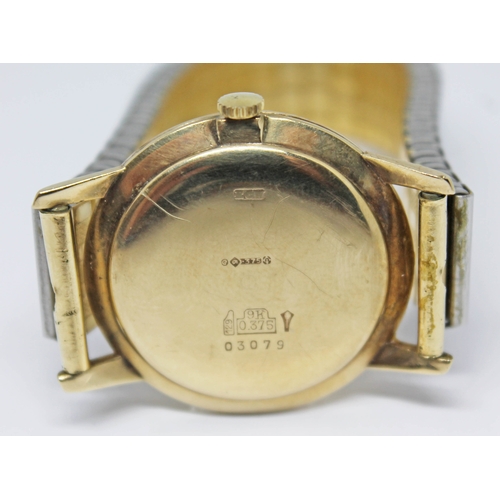 122 - A 1960s hallmarked 9ct gold Elco wristwatch with signed champagne dial, gold tone hour markers and d... 