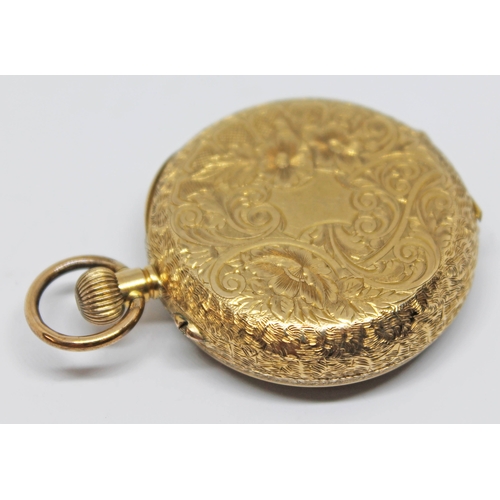 135 - A ladies pocket watch marked 18k with engraved central design to dial, Roman numerals and spade hand... 