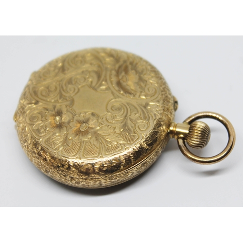 135 - A ladies pocket watch marked 18k with engraved central design to dial, Roman numerals and spade hand... 