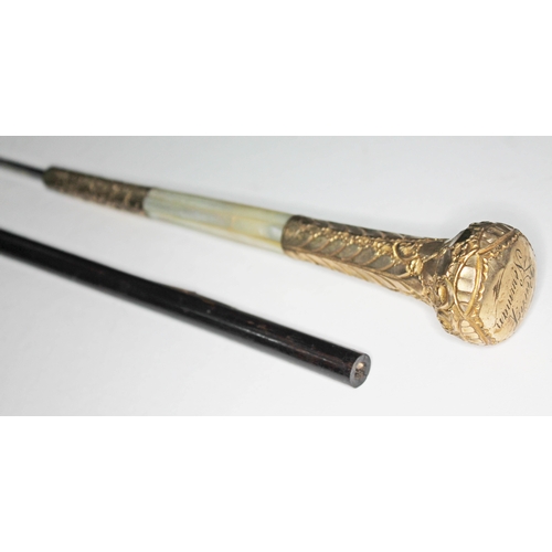 299 - A sword stick with yellow metal and mother of pearl handle, blade length 68cm, total length 93cm.