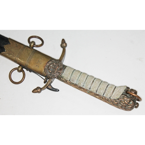 304 - An early 19th century midshipmen short sword and scabbard, with brass lion head and mane hilt, wire ... 