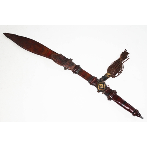 307 - A kaskara with leeather scabbard and grip, blade length 50cm, total length 69cm.