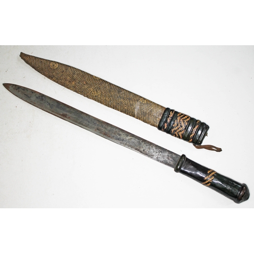 308 - An African short sword with snakeskin and leather scabbard and leather grip, blade length 35cm, tota... 