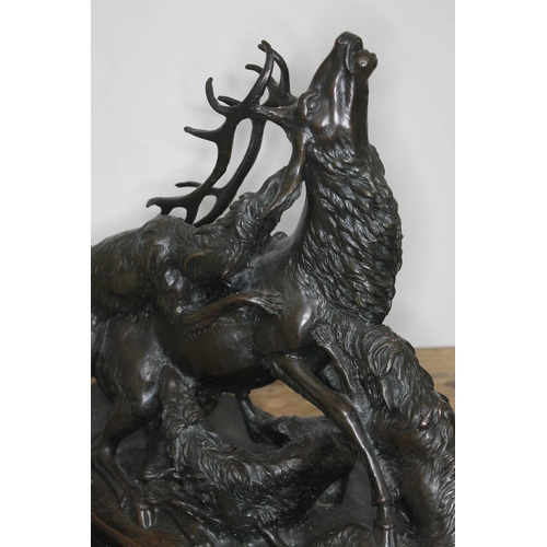 314 - A bronze sculpture depicting three wolves attacking a stag, signed 'G Gardet', on marble base, heigh... 