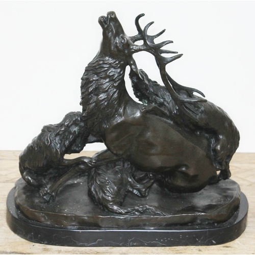 314 - A bronze sculpture depicting three wolves attacking a stag, signed 'G Gardet', on marble base, heigh... 