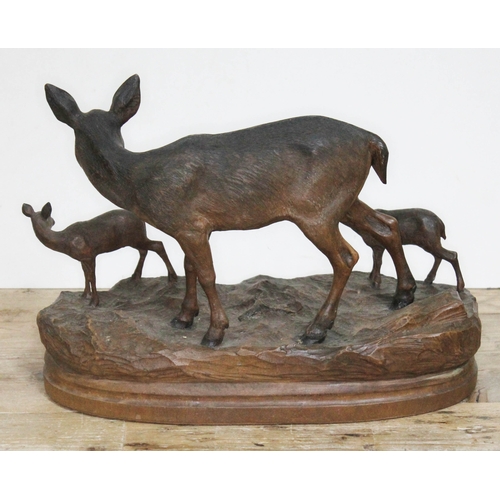 316 - A finely carved Black Forest wood sculpture depicting three deer on naturalistically formed base, in... 