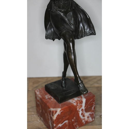 319 - An Art Deco style bronze figure depicting a lady dancing on square marble base, signed 'Descomps' an... 