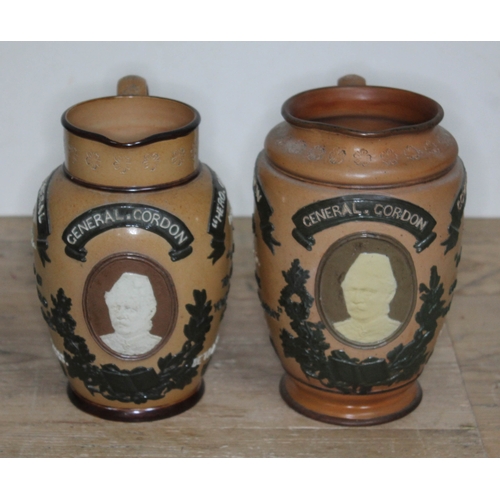 322 - A matched pair of Doulton Lambeth General Gordon Commemorative stoneware jugs, heights 18.5cm & 19.5... 