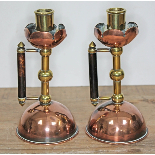 329 - A pair of Arts & Crafts copper and brass candlesticks, manner of Christopher Dresser/Benham & Froud,... 