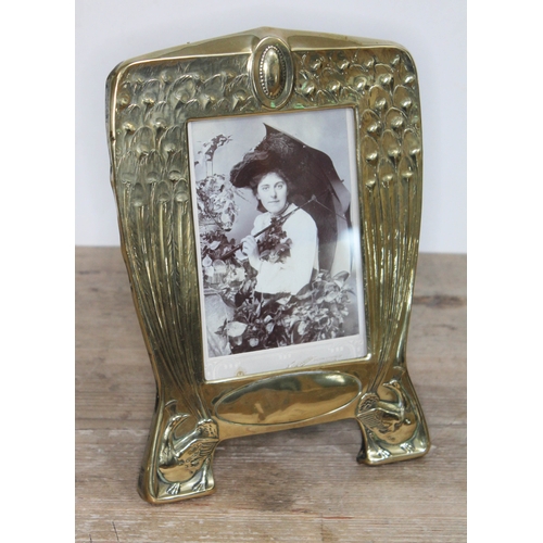 330 - An Edwardian brass photoframe designed with peacocks, height 25cm.