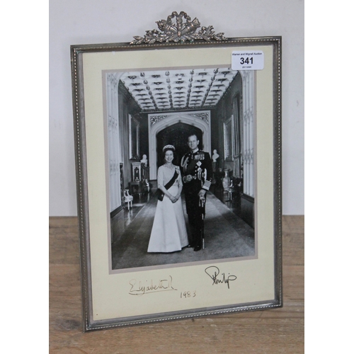 341 - Elizabeth II and Prince Philip signed presentation photograph, dated 1983,glazed with white metal fr... 