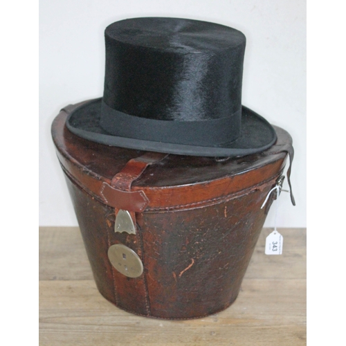 343 - A Tress & Co silk top hat, retailed by Rufus Sanderson, Leeds, with red velvet lined lockable leathe... 