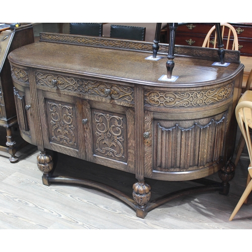 62 - A 1930s Jacobean style carved oak sideboard, length 165cm, depth 59cm & height 101cm.