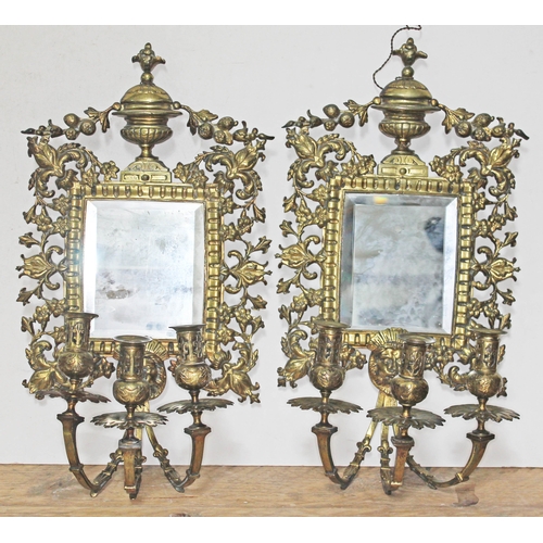 75 - A pair of 19th century gilt bronze girandole mirrors and sconces, length 55cm, width 29cm.