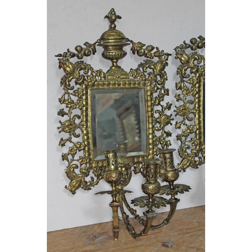 75 - A pair of 19th century gilt bronze girandole mirrors and sconces, length 55cm, width 29cm.