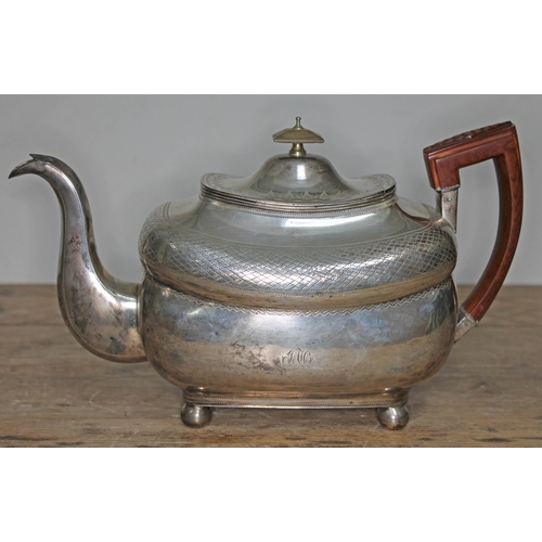 84 - A George III Irish silver teapot, with wooden handle, horn finial, engraved, ball feet, maker's init... 