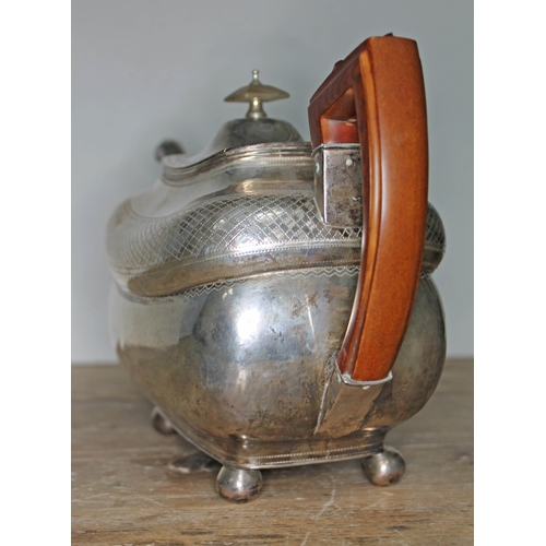 84 - A George III Irish silver teapot, with wooden handle, horn finial, engraved, ball feet, maker's init... 