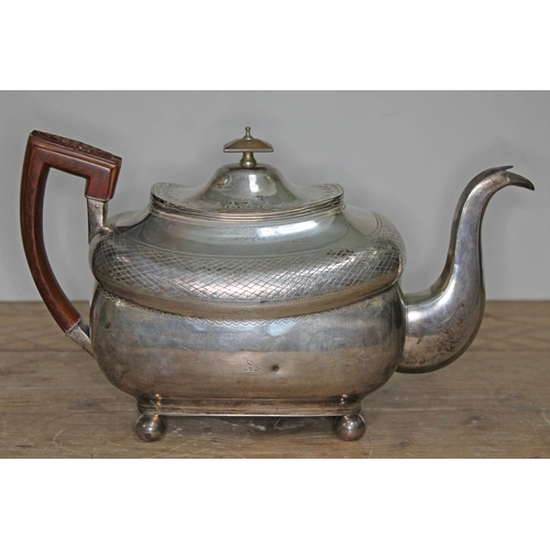 84 - A George III Irish silver teapot, with wooden handle, horn finial, engraved, ball feet, maker's init... 